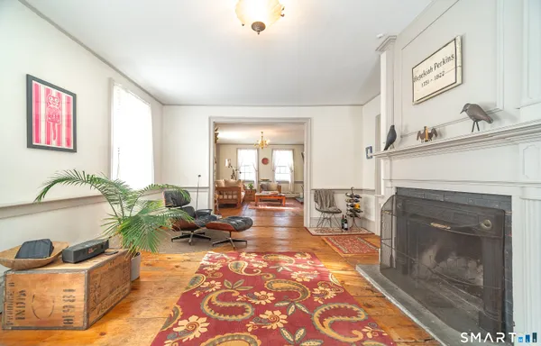 a living room with furniture a window and a fireplace
