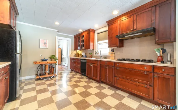 a kitchen with a sink a stove a microwave and cabinets