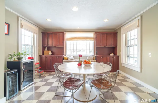 a dining room with furniture and window