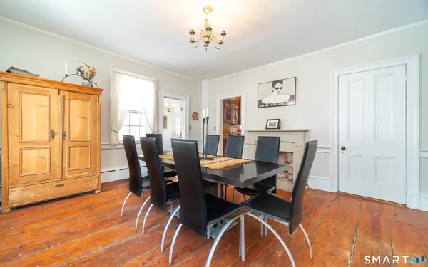 a view of a dining room with furniture and wooden floor