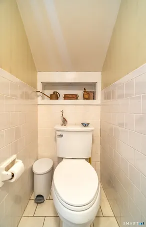 a bathroom with a toilet and a sink