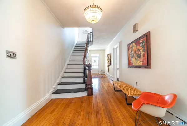 a view of entryway with wooden floor