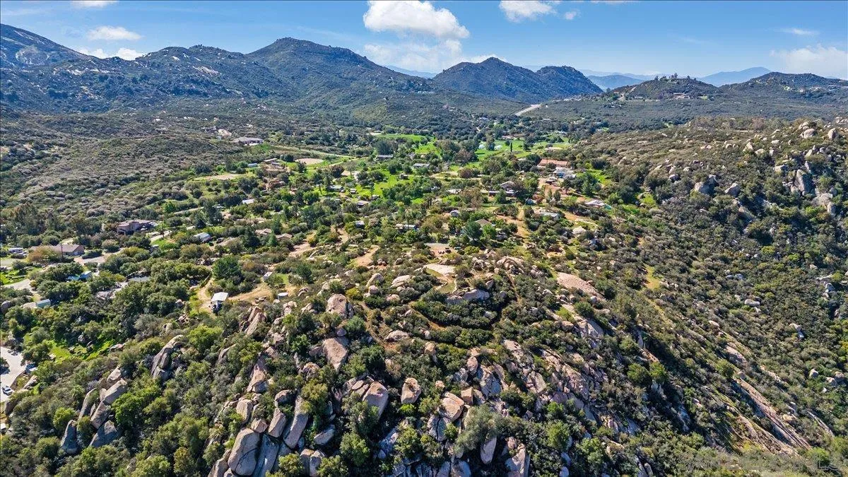 0 Barona Road, Unit 82082 Lakeside, CA 92040 - Photo 10 of 26 a view of a lush green hillside and a building
