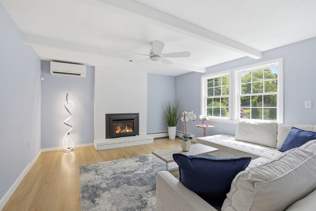 94 Johnson Road Winchester, MA 01890 - Photo 12 of 40 a living room with furniture and a fireplace