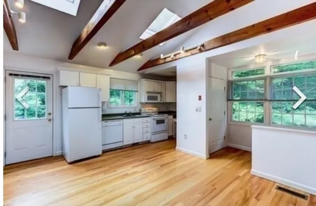 a kitchen with stainless steel appliances a refrigerator and a stove