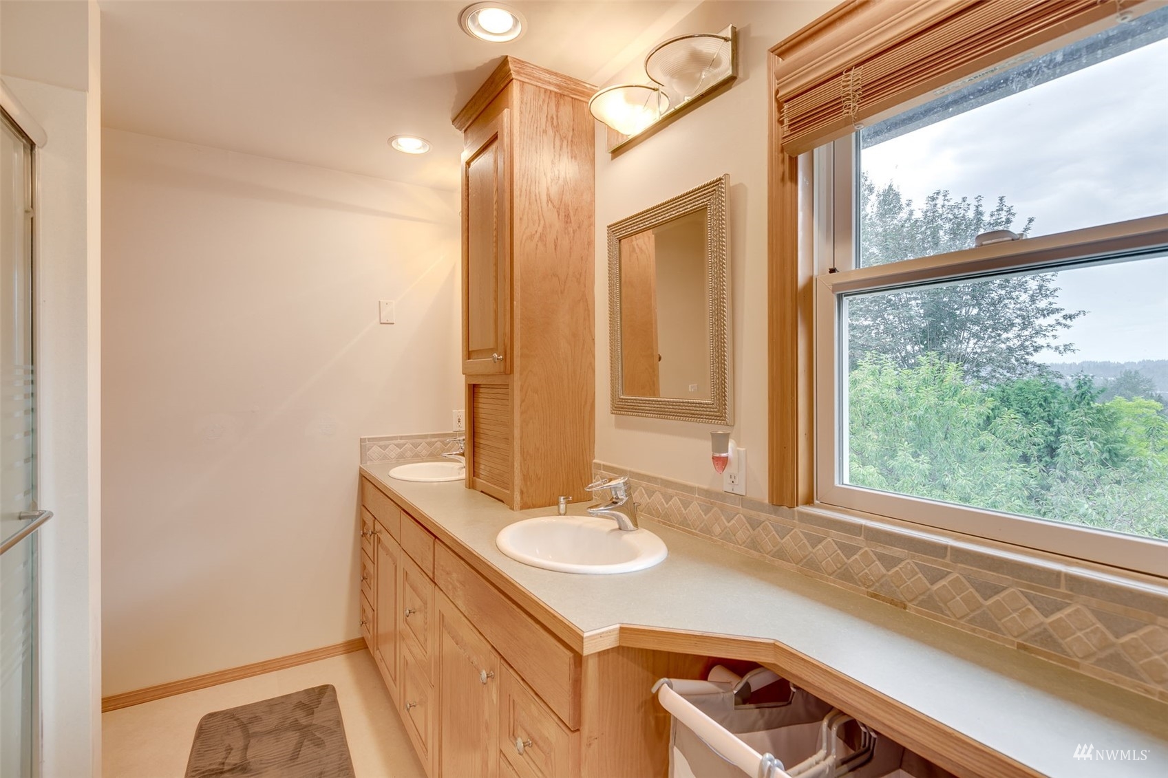 22417 4th Avenue Southeast Bothell, WA 98021 - Photo 13 of 27 a bathroom with a sink and a mirror