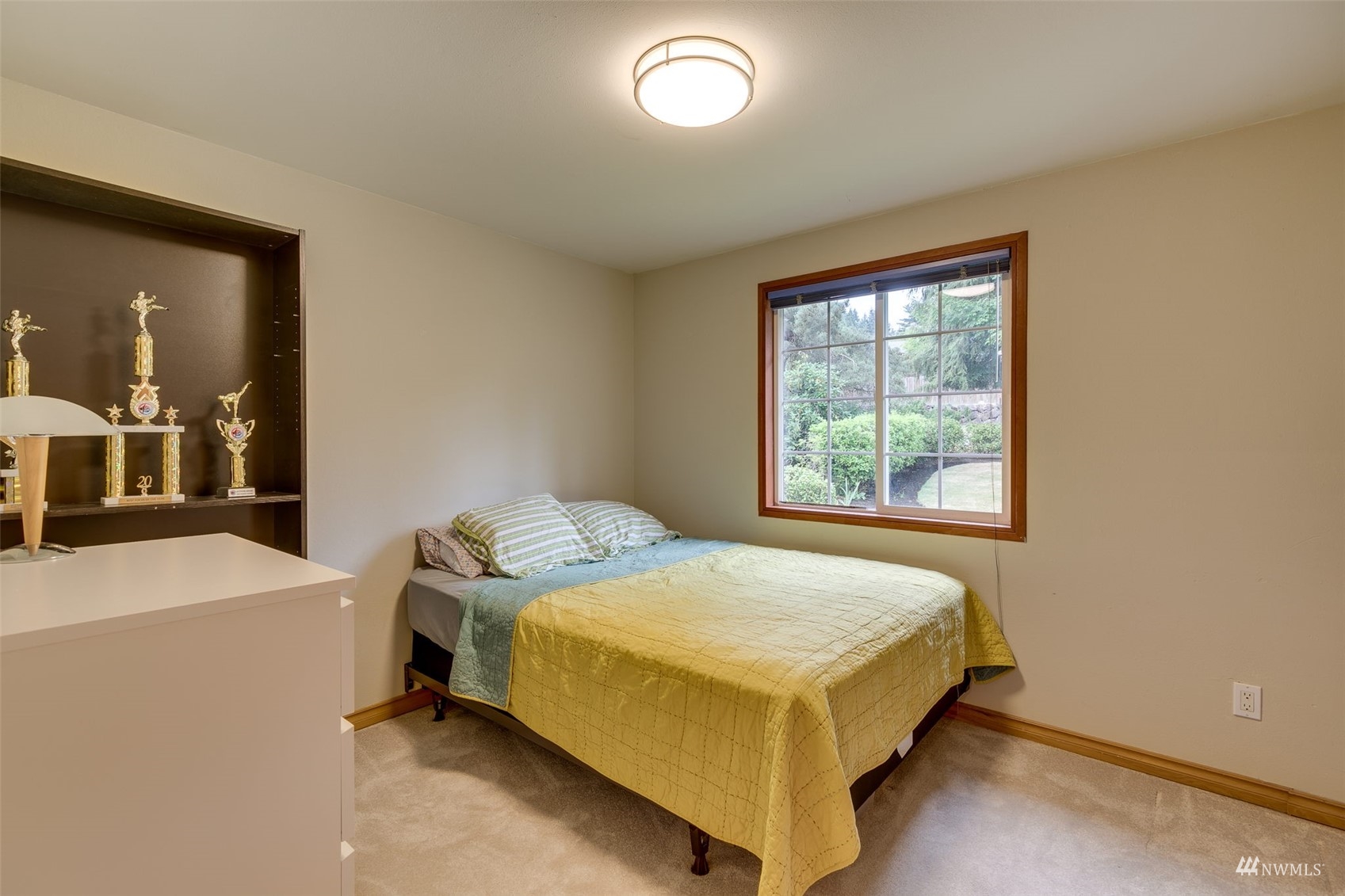 22417 4th Avenue Southeast Bothell, WA 98021 - Photo 14 of 27 a bed sitting in a bedroom next to a window