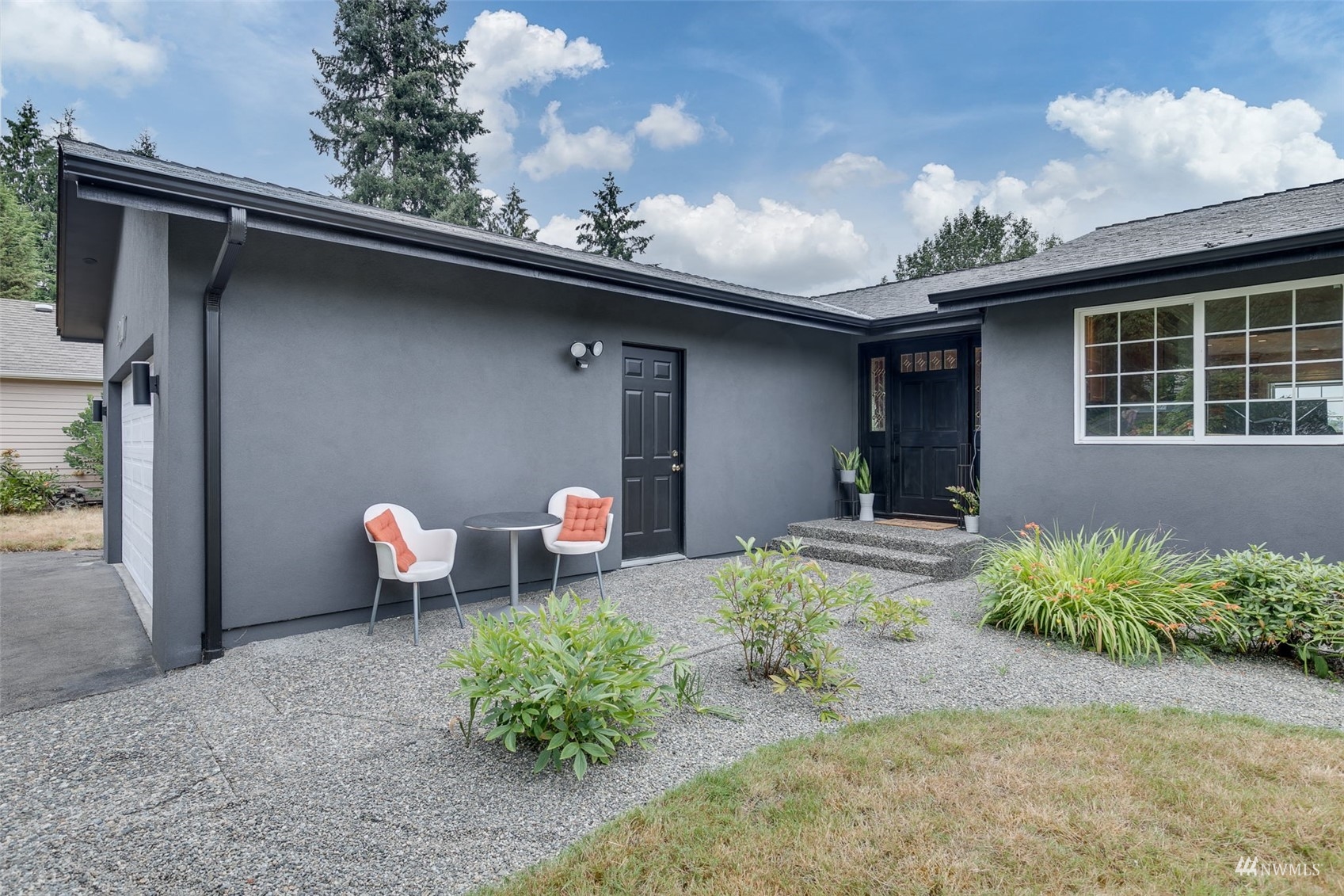 22417 4th Avenue Southeast Bothell, WA 98021 - Photo 2 of 27 a backyard of a house with table and chairs