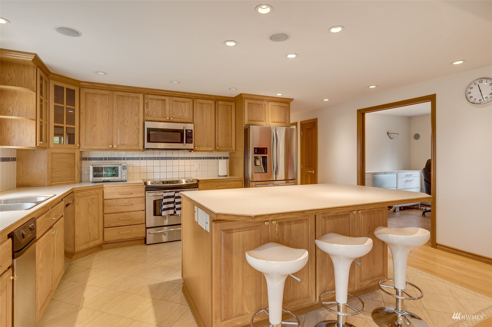 22417 4th Avenue Southeast Bothell, WA 98021 - Photo 8 of 27 a kitchen with a stove a sink and a refrigerator