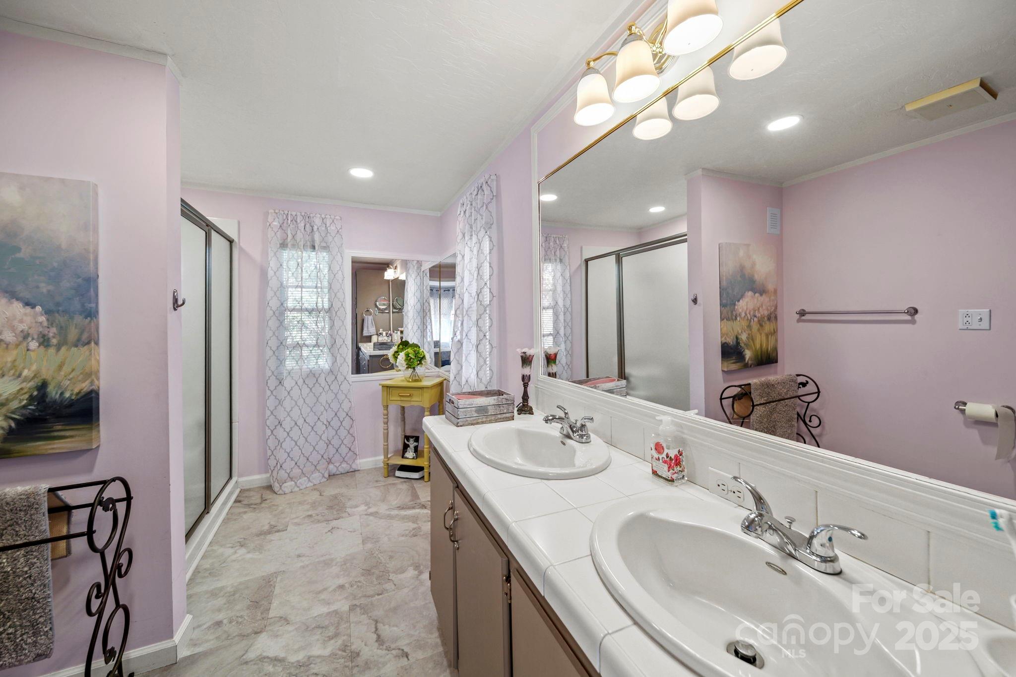 2107 Gheen Road Salisbury, NC 28147 - Photo 18 of 32 a bathroom with a sink double vanity and a mirror