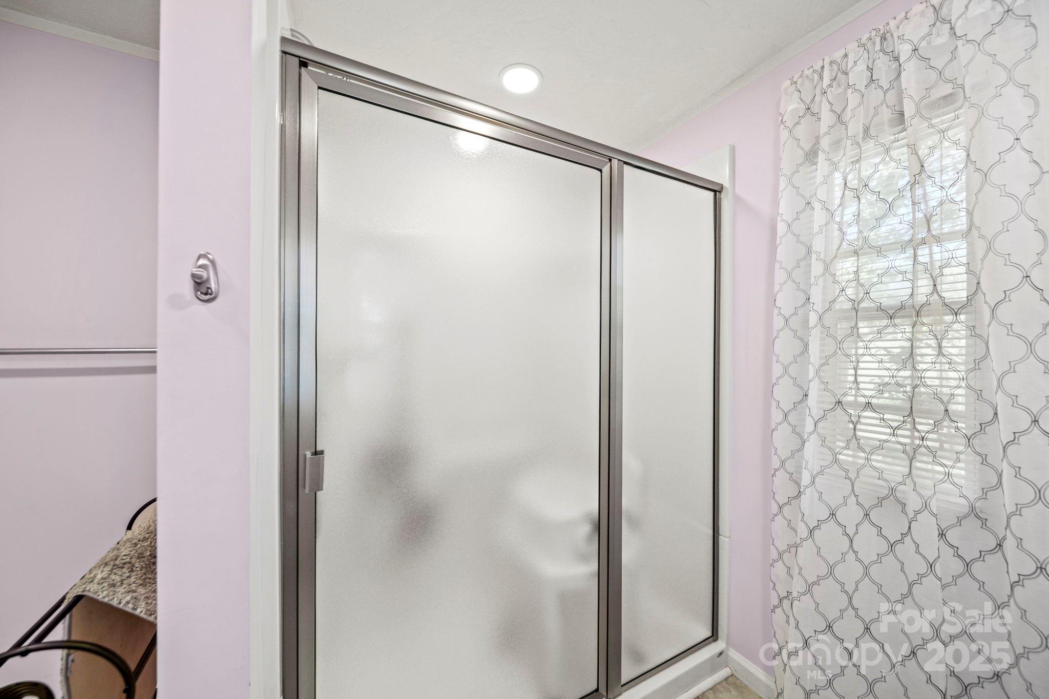 2107 Gheen Road Salisbury, NC 28147 - Photo 19 of 32 a bathroom with a shower and a glass door