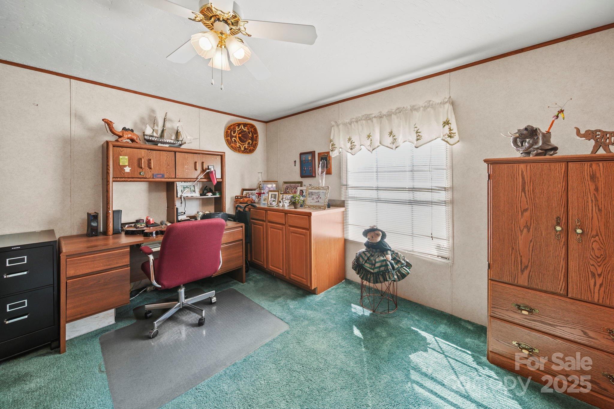 2107 Gheen Road Salisbury, NC 28147 - Photo 23 of 32 a view of a workspace with furniture and a window