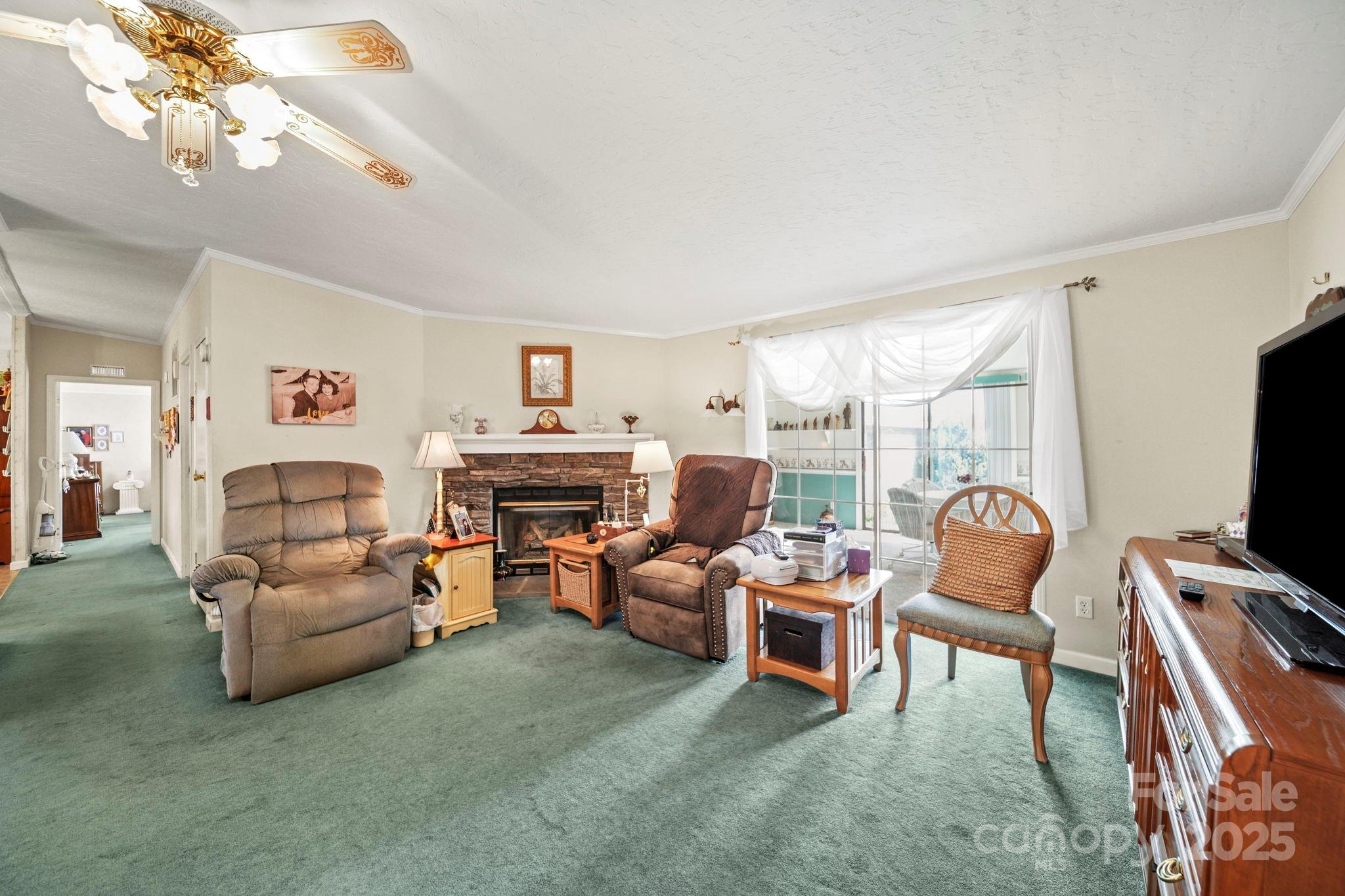 2107 Gheen Road Salisbury, NC 28147 - Photo 6 of 32 a bedroom with furniture and a chandelier