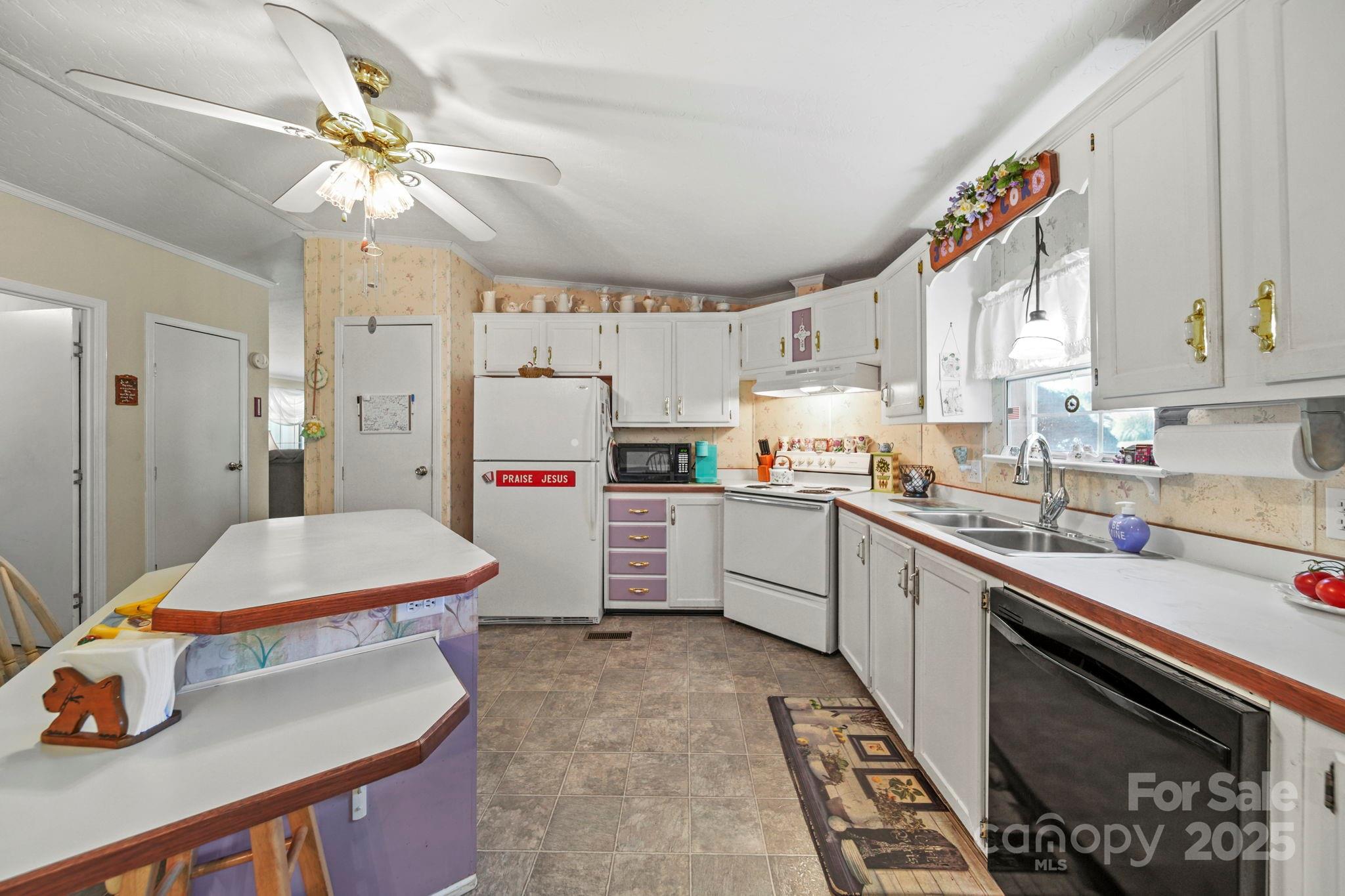 2107 Gheen Road Salisbury, NC 28147 - Photo 10 of 32 a kitchen with a sink appliances and cabinets