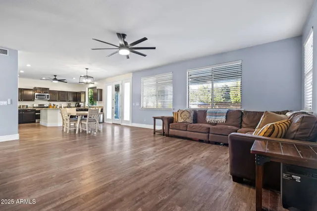 a view of a house with pool and chairs