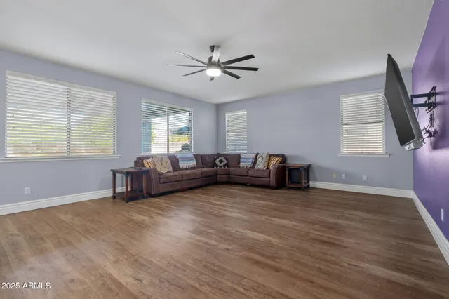 a view of balcony with wooden fence and potted plants