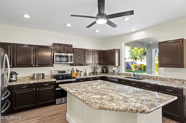 a view of a porch with furniture and a yard