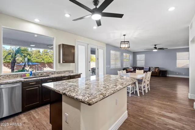 a swimming pool view with a outdoor seating