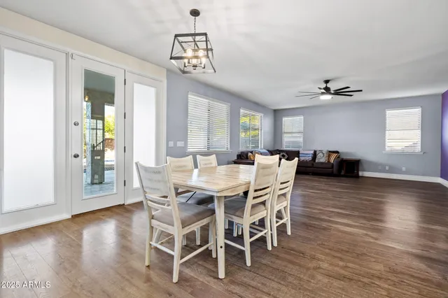 a swimming pool with outdoor seating and yard