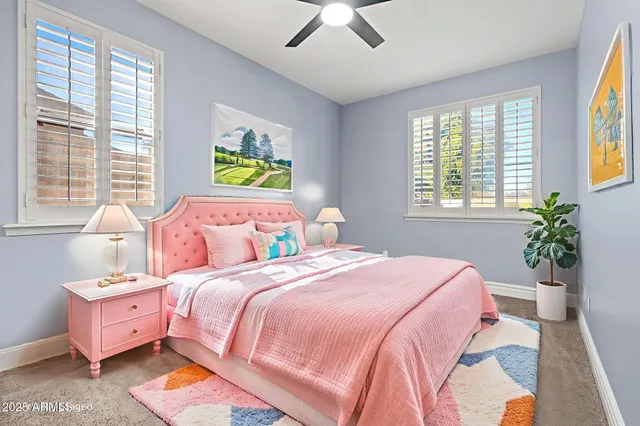 a view of a swimming pool with outdoor seating and a yard