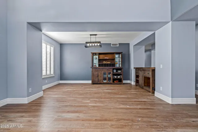 a bedroom with a bed and a potted plant