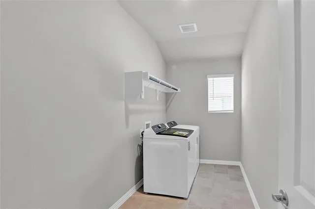 a utility room with a window dryer and washer