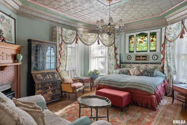 a bedroom with two beds and a dresser