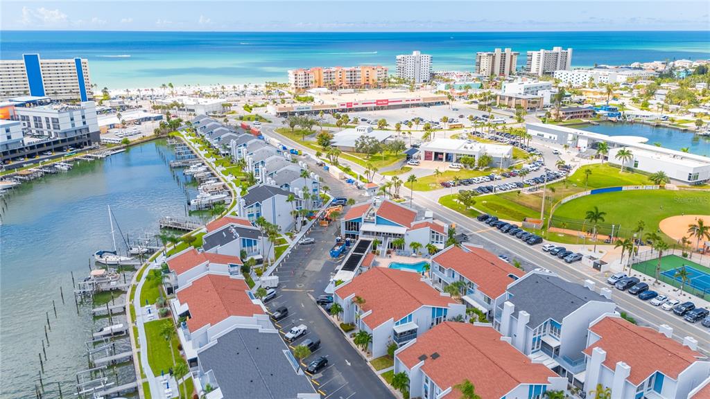 230 Medallion Boulevard, Unit E Madeira Beach, FL 33708 - Photo 25 of 35 an aerial view of residential houses with outdoor space