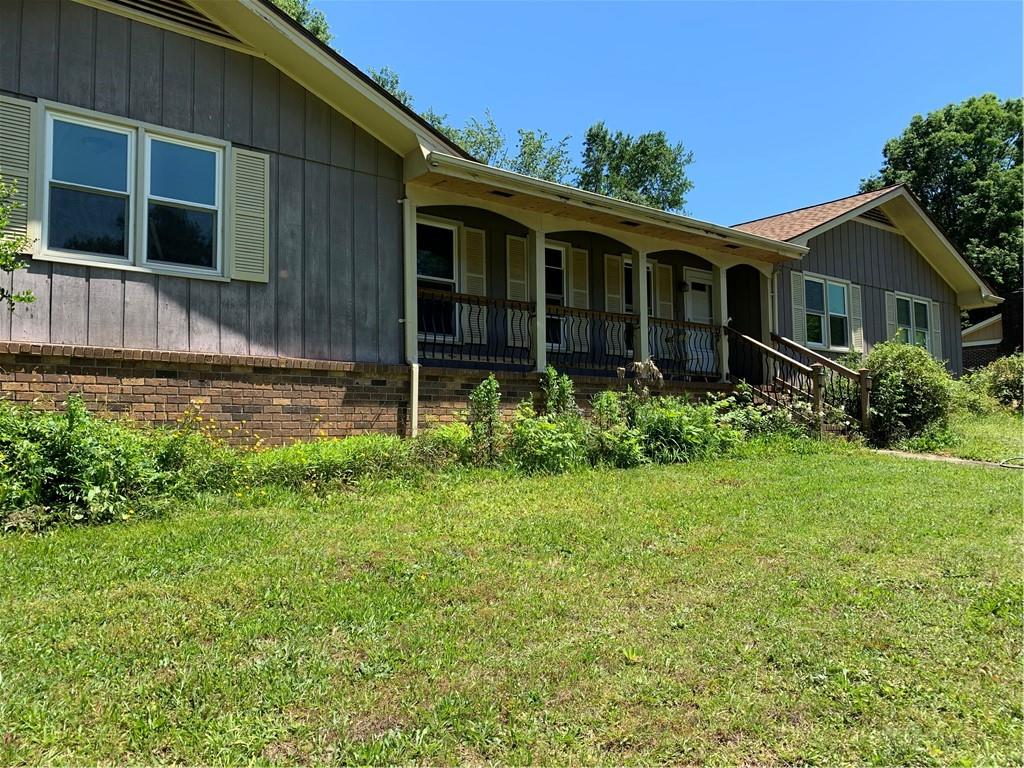 505 Yargo Lane Winder, GA 30680 - Photo 1 of 1 a backyard of a house with plants and garden