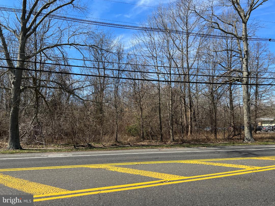 328 Stokes Road Medford, NJ 08055 - Photo 3 of 7 a view of a swimming pool with a house in the background