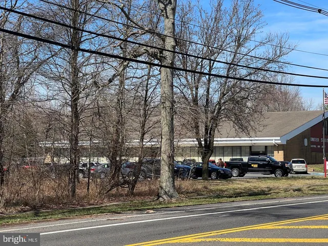 a view of street with parked cars