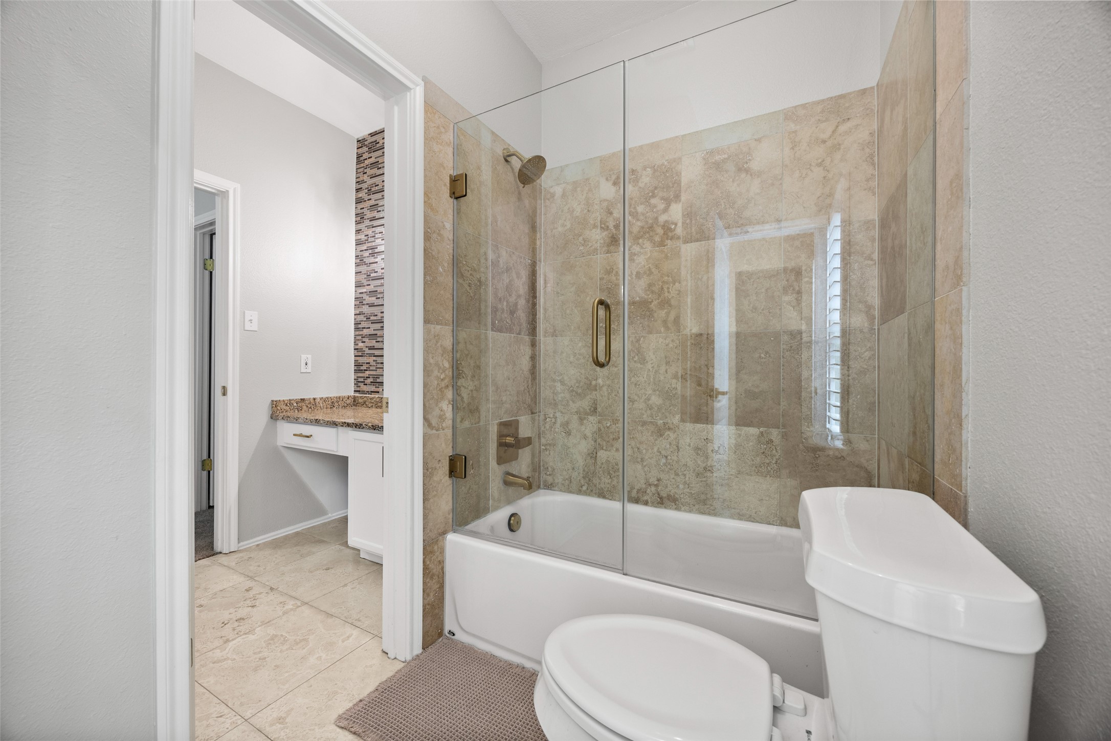 8610 Axis Drive Austin, TX 78749 - Photo 23 of 29 a bathroom with a toilet a sink and bathtub