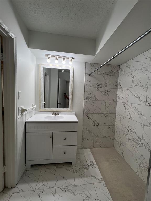 a bathroom with a double vanity sink and mirror