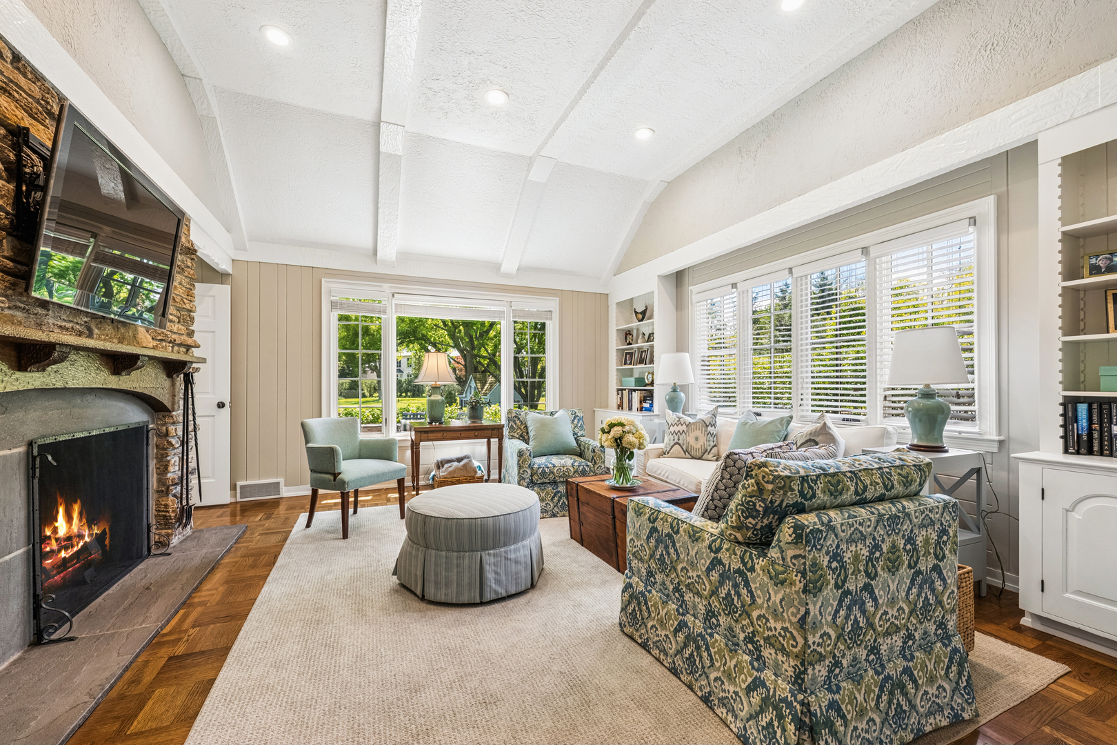 936 Sunset Road Winnetka, IL 60093 - Photo 25 of 50 a living room with furniture and a fireplace