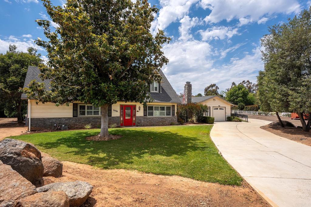 2430 Geyer Lane Alpine, CA 91901 - Photo 54 of 60 a front view of a house with a yard and garage
