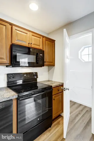 a kitchen with a stove and a microwave