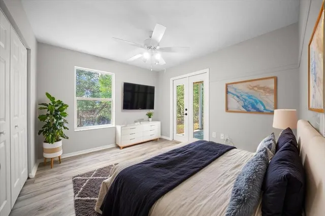a bathroom with a granite countertop sink a toilet and bathtub