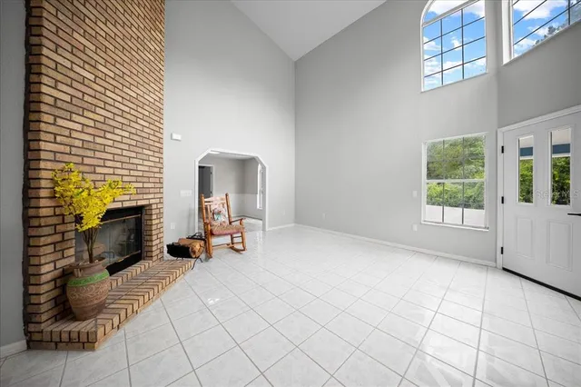 a view of a livingroom with furniture and a fireplace