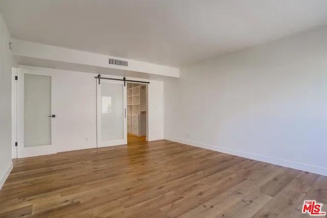 a bathroom with a shower sink and mirror