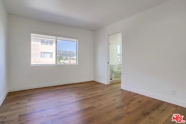 a view of a chairs and table in patio with a fire pit