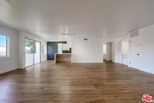 a view of a livingroom with wooden floor