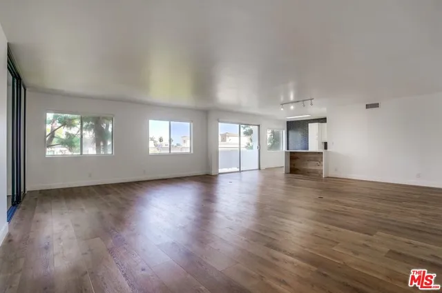 a kitchen with stainless steel appliances a refrigerator sink and stove