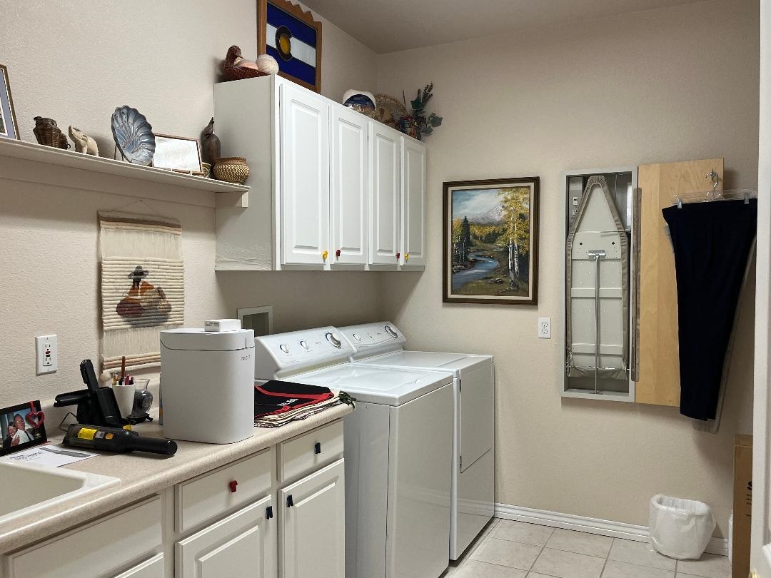 2297 Shiprock Road Grand Junction, CO 81507 - Photo 11 of 12 a view of a kitchen with fridge and workspace