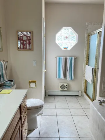 a living room with a couch and a chandelier