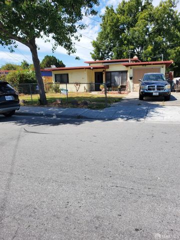a car parked in front of white house