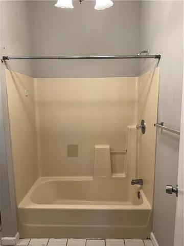 a bathroom with a sink toilet and mirror