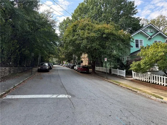 a view of street with parked cars