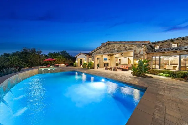 a view of swimming pool with lounge chair