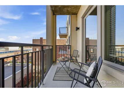a view of a balcony with furniture
