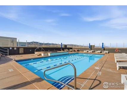 a view of a swimming pool with seating area
